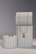 Juego de pendientes y collar de perlas clam en oro rosa